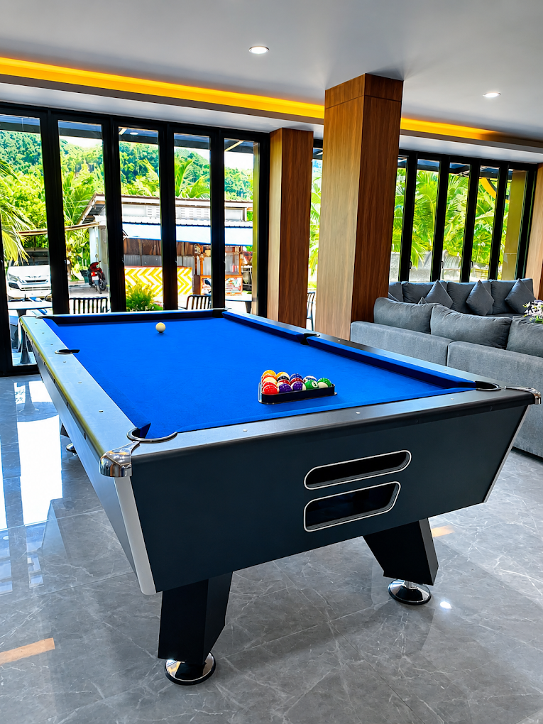 Pool table and games room at Happy Hotel